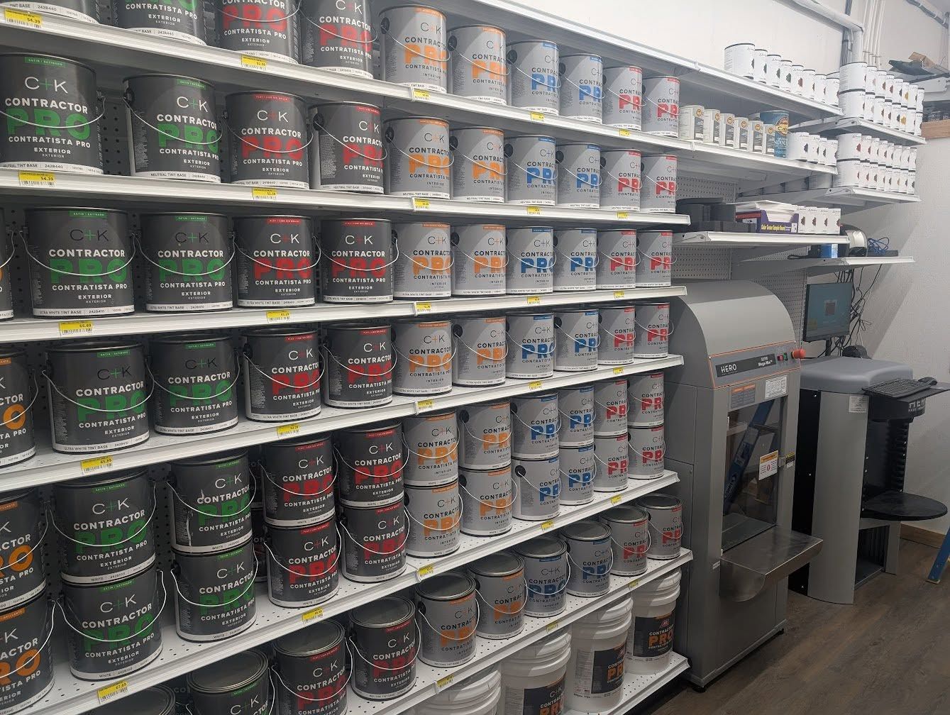 Wall of contractor-grade interior and exterior paint next to the paint tinting machine